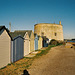 Martello Tower and beach huts, Ferry Road, Felixstowe, Suffolk