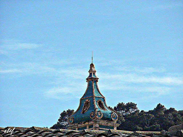 blue steeple against blue sky