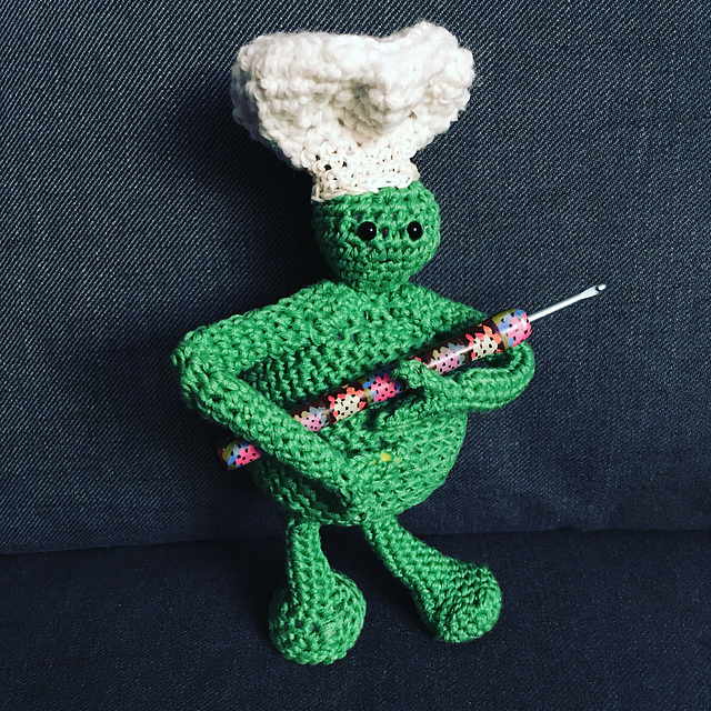 Amigurumi chef holding hook