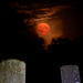 Super Blue Moon rises over gravestones.