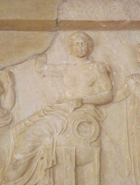 Detail of a Votive Relief from Athens with Apollo, Artemis, and Leto in the National Archaeological Museum in Athens, May 2014