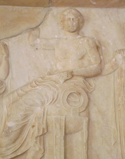 Detail of a Votive Relief from Athens with Apollo, Artemis, and Leto in the National Archaeological Museum in Athens, May 2014