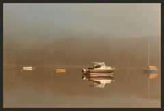 boats in the morning mist