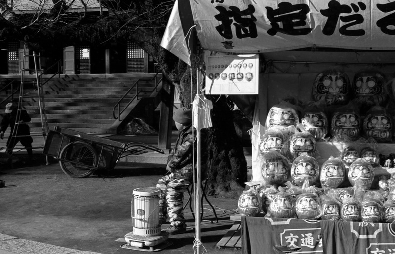 Vendor using a heater for warmth