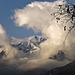 They open a window in the clouds and appear the snowy peaks