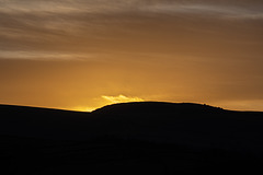 The sun setting beyond Whiteley Nab