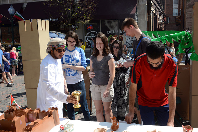 Basel Al Saadi, from Oman, describes his country to visitors.