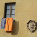 Italy, Pienza, Window, Drying Towels and Someone's Coat of Arms