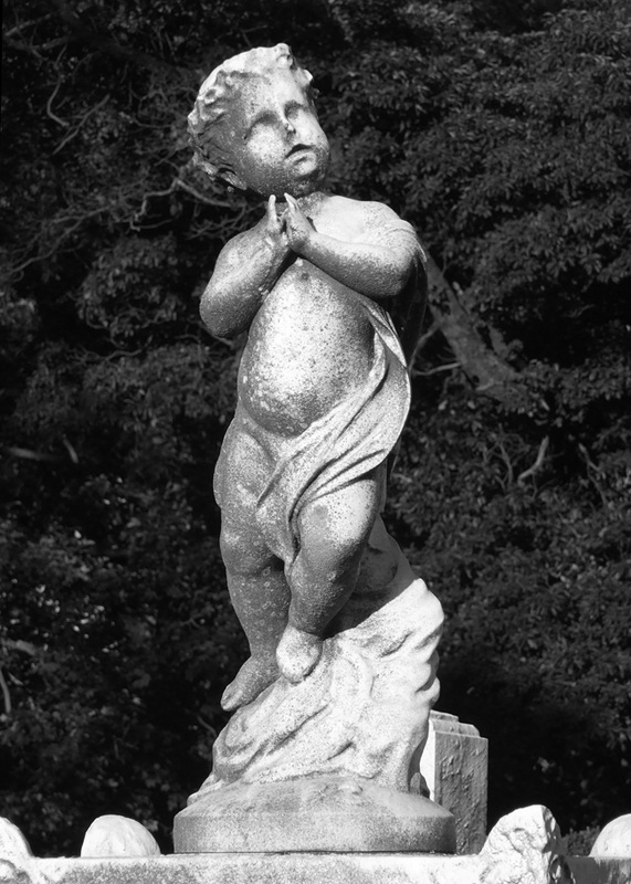 Grave with a Praying Cherub in Greenwood Cemetery, September 2010