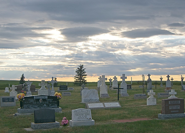 sun setting on crosses