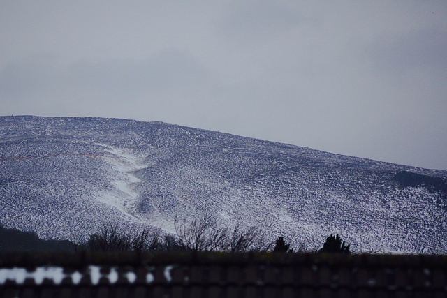 The snow has blown off the hills into the valleys