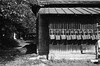 Dustpans hung tidily in a shrine precinct