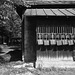 Dustpans hung tidily in a shrine precinct