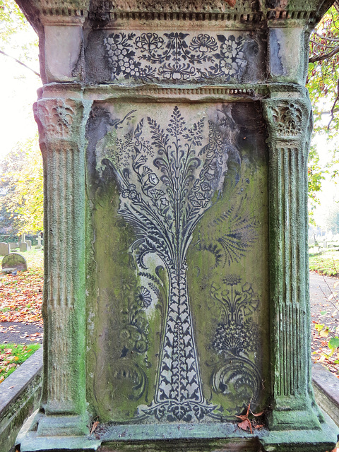 brompton cemetery, london,beautifully inlaid leadwork on the back of this c19 monument, with "music, art, drama" written at the base