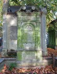 brompton cemetery, london,beautifully inlaid leadwork on the back of this c19 monument, with "music, art, drama" written at the base