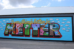 A new Mural just painted on side of a warehouse in town.! :)  yes, that's the town's logo..!  its Better in Metter....
