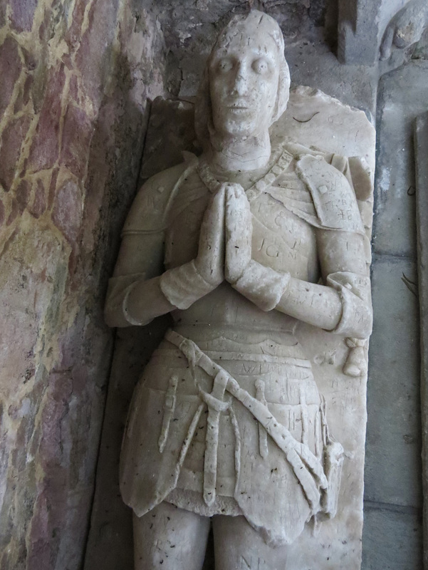 modbury church, devon,effigy of a late c15 knight of   in the south transept, with collar of roses
