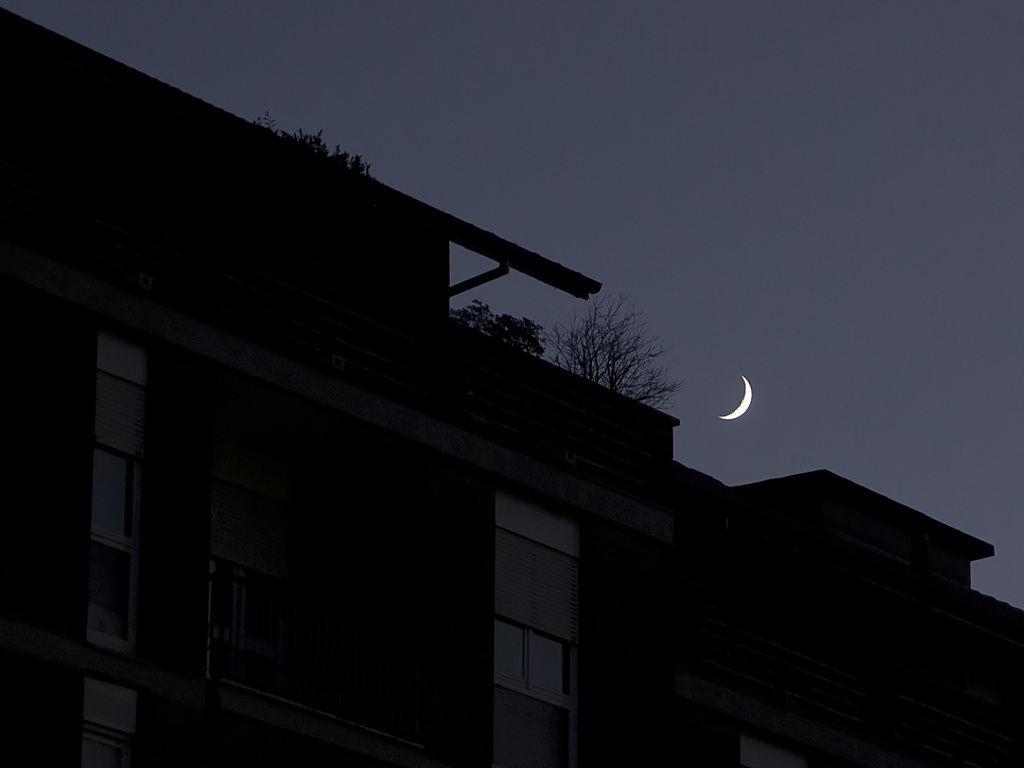 The moon on the buildings dormant