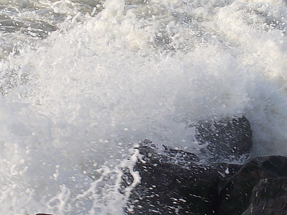 The boulders break up the waves but also makes good splashes