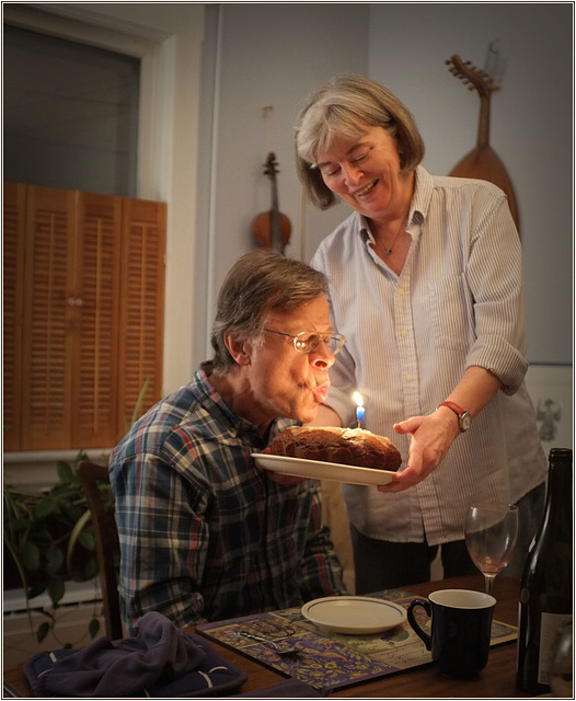 Birthday boy ingressively blows out candle