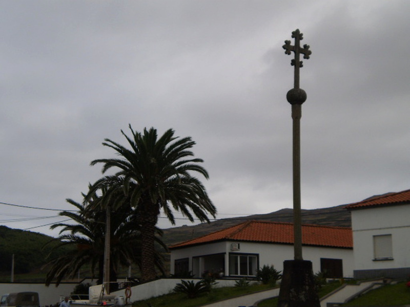 Cross on road junction.