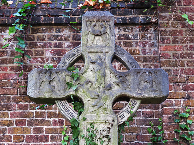 brompton cemetery, london,early c20 cross with resurrection carved between angels on the head