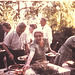 Grandma practices her "boarding house reach" as other family members also fill plates, August, 1961.