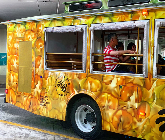 tourist bus leaving the parking structure