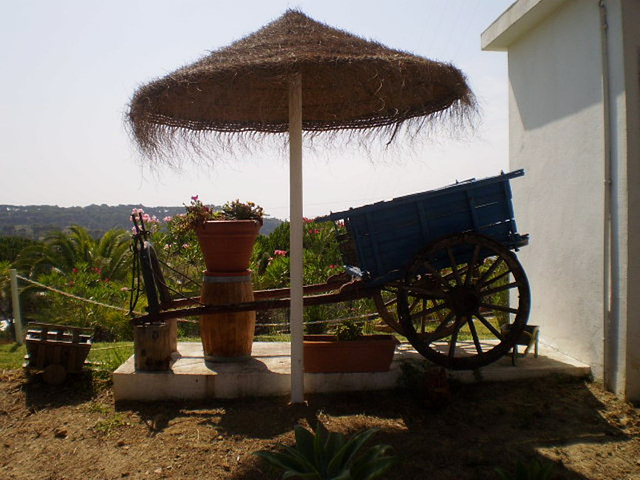 Replicas of carts and wheel-barrow.