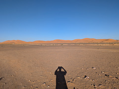 L'ombrage du photographe de dunes