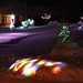 The strange effect of Christmas Lights under the snow.