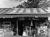 Shop with many sandbags on the roof