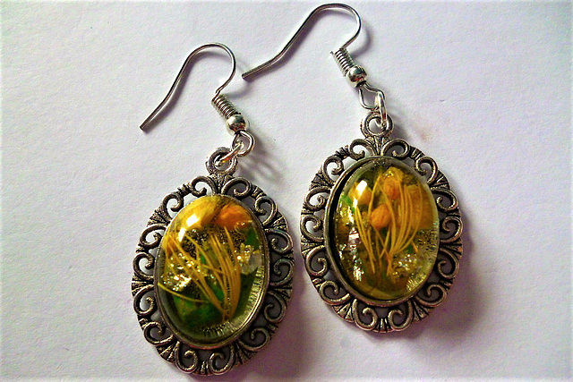 Yellow and green flowers in oval earrings