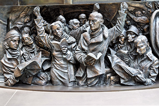 Weary Straphangers – Frieze below the "Meeting Place" Statue, St Pancras Railway Station, Euston Road, London, England