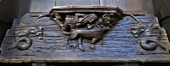 boston church,lincs (18) c14 misericord man lion dragon