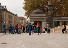 Children dancing to accordion music on the bridge