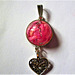 Heart pendant with pink geranium