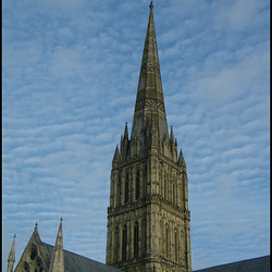 spire in a dappled blue sky