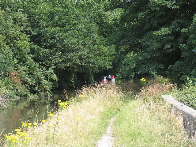 Canal boat approaching Milford Aqueduct on the Staffs and Worcs Canal