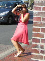 girl on stiletto heels taking pictures