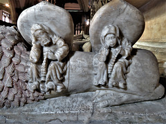 strelley church, notts; bedesmen under feet of effigy on c16 tomb of john de strelley +1501