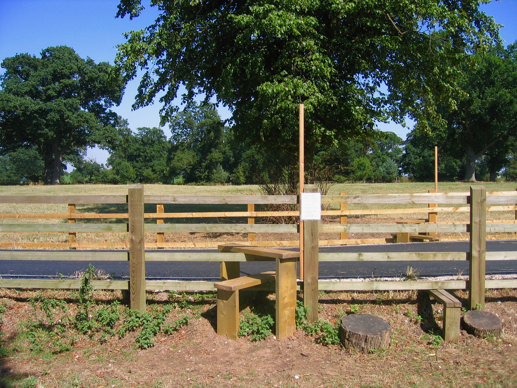 Approaching the track that leads to Haselour Hall, what does the notice say?