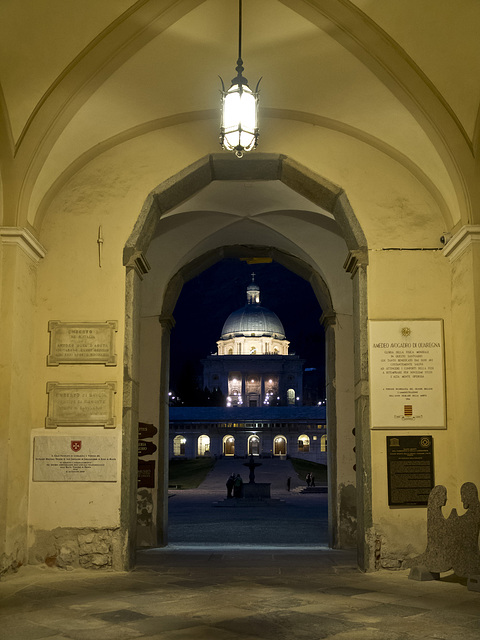 Oropa Sanctuary. Biella -  Beyond the arc, the fountain and the dome of the New Church -