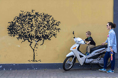 boy scooter and mural