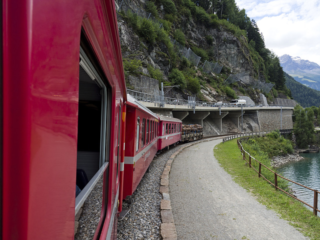 Bernina Red Train - On the coast of the Poschiavo Lake, Switzerland