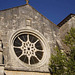 Sainte Claire Church - rose window and belfry.