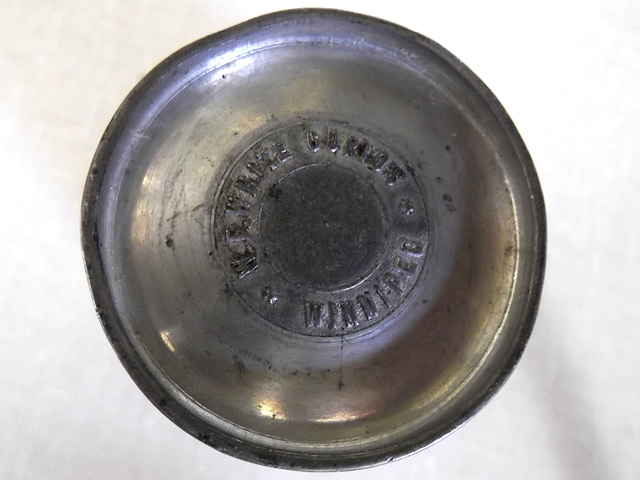 Souvenir Cup: (Bottom) W. E. White * Curios * Winnipeg
