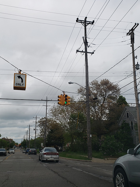 Long row of assorted CE 46kv poles along Detroit Ave in Flint