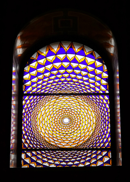 Stained-glass window at the top of the stairs