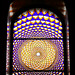Stained-glass window at the top of the stairs
